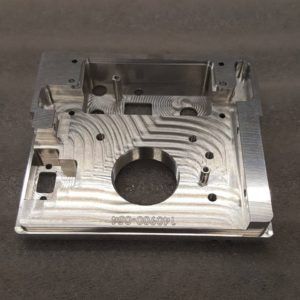 A piece of metal with a hole in the middle is sitting on a table.