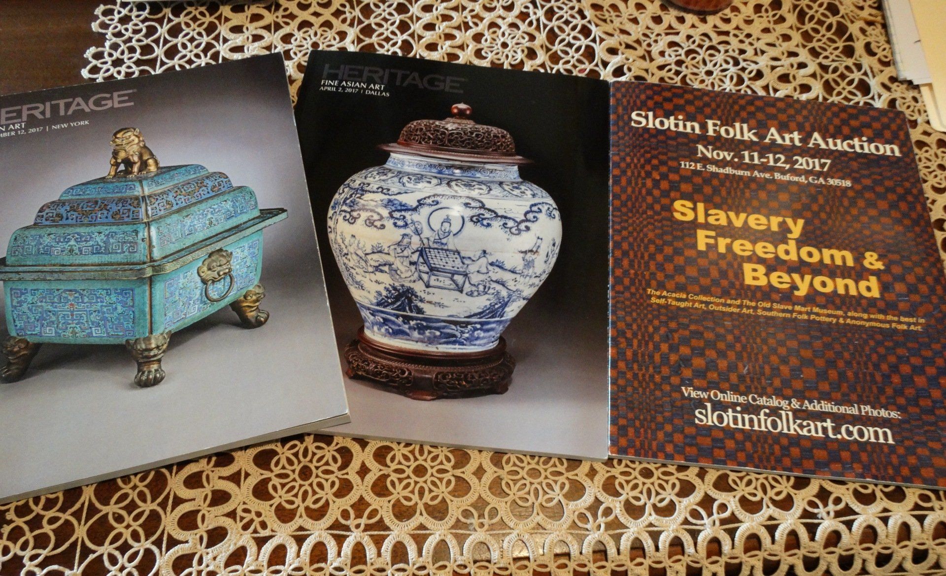 A book titled slavery freedom and beyond is sitting on a table.