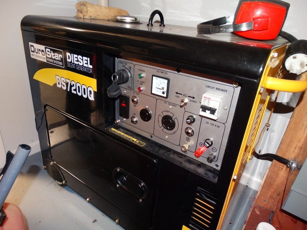 A diesel generator is sitting on a table in a room