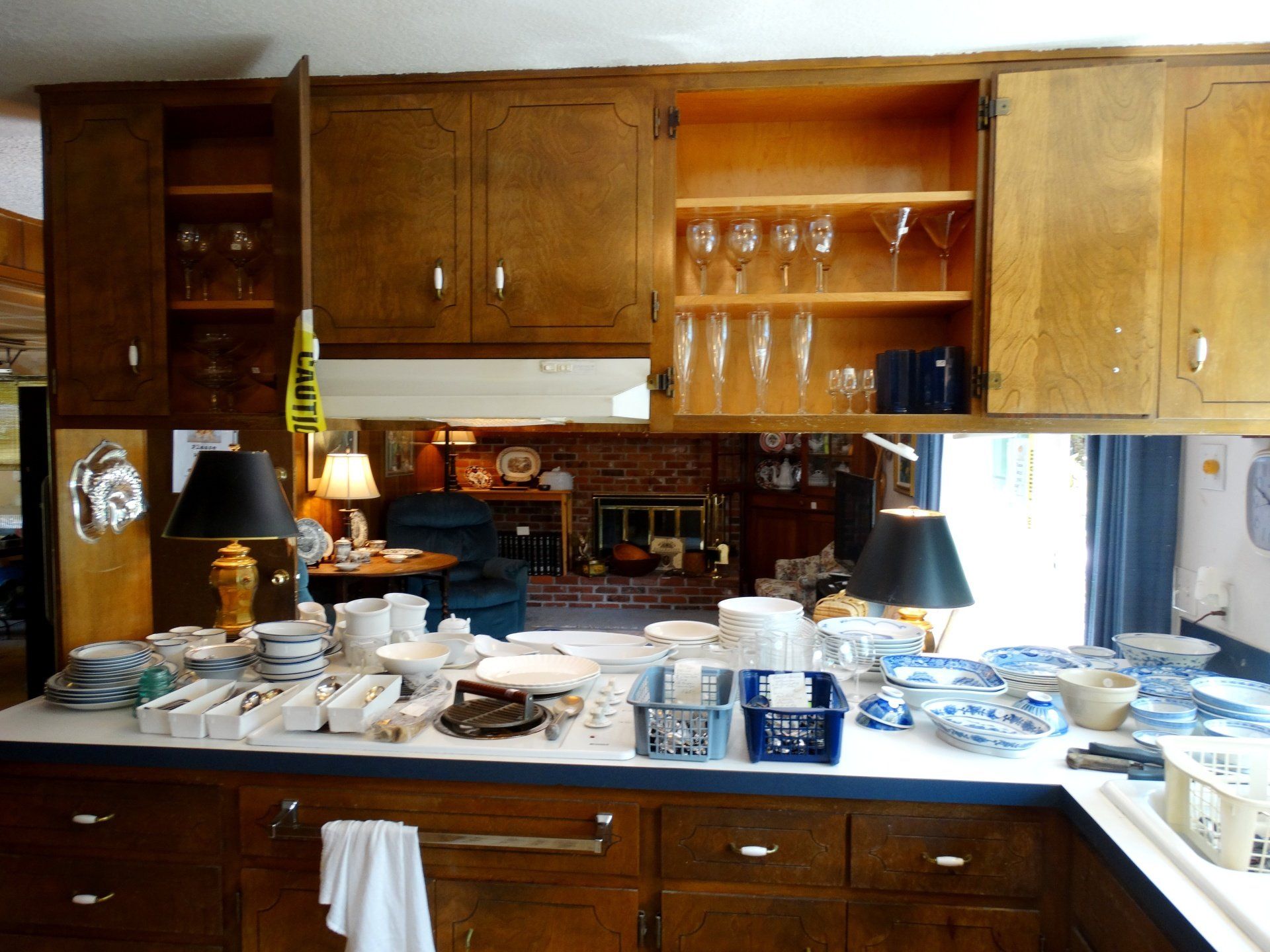 A kitchen with a lot of dishes on the counter