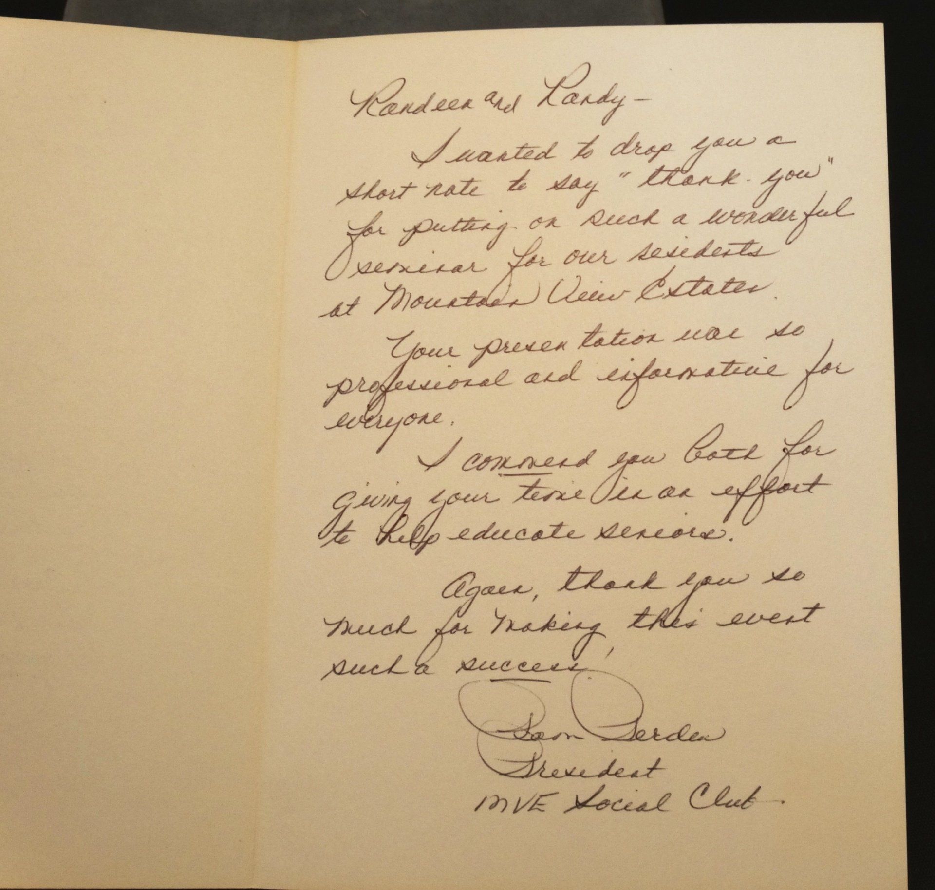 A handwritten letter is open to a page that says 