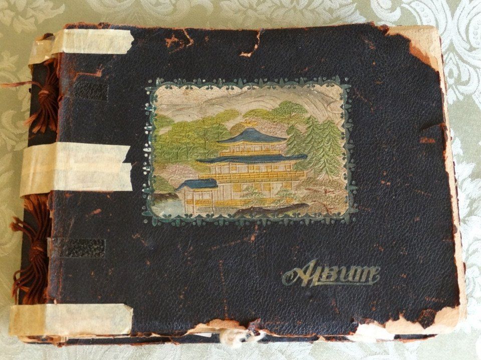 An album with a picture of a house on the cover