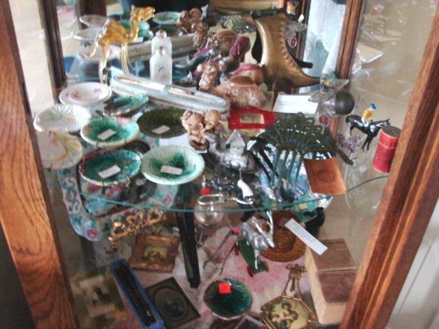 A display case with a lot of items on it