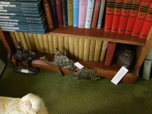 A bookshelf with a lot of books on it