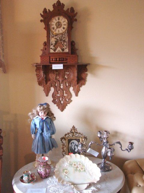 A clock hanging on a wall with the word u.s.a. on it