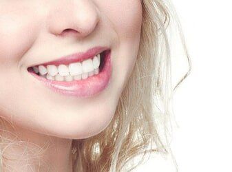Woman Smiling with a White Teeth - Cosmetic Dentists in Terre Haute, IN A woman who received cosmetic dentistry near Brazil, IN