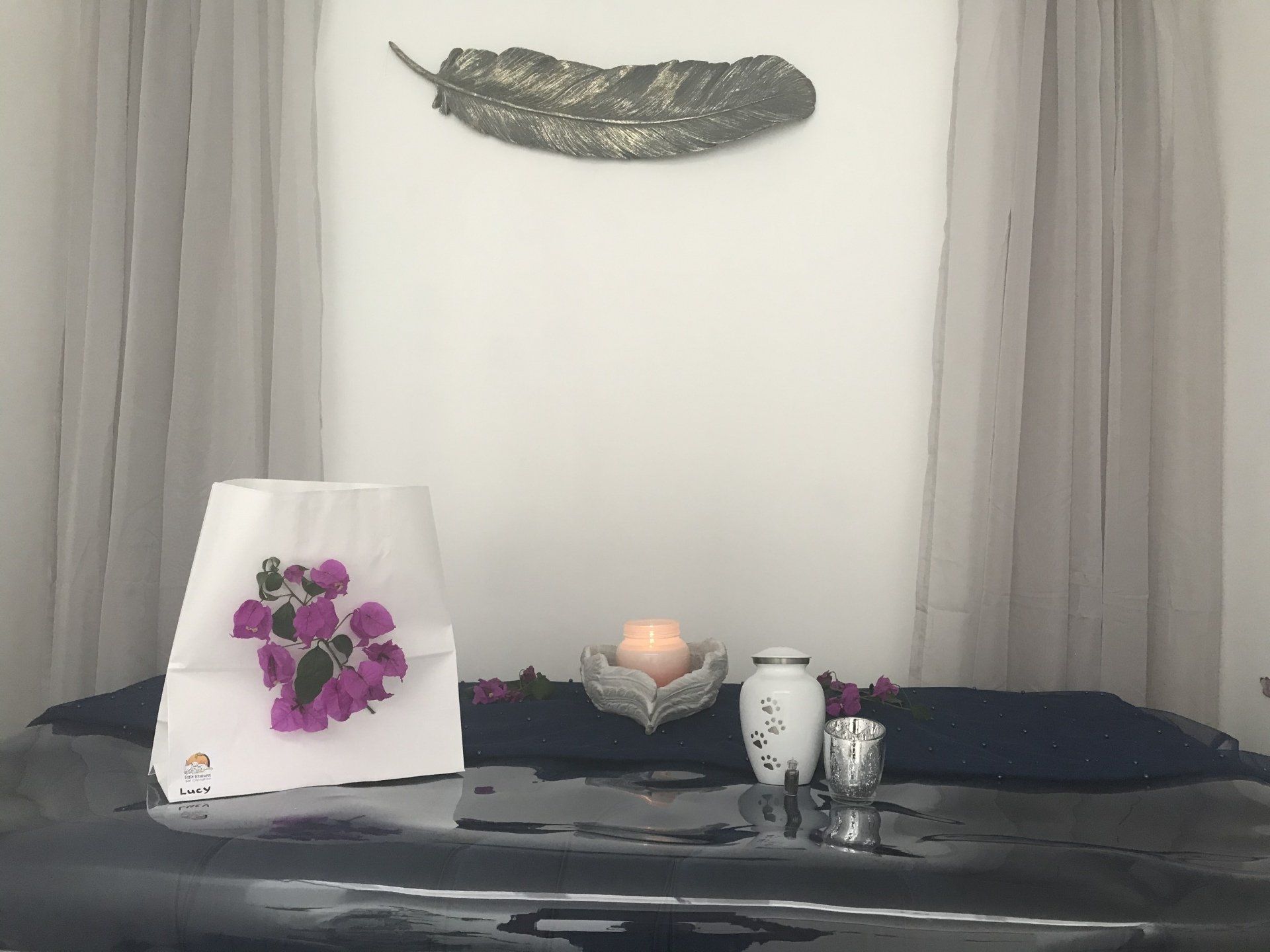 farewell room with florals and urns