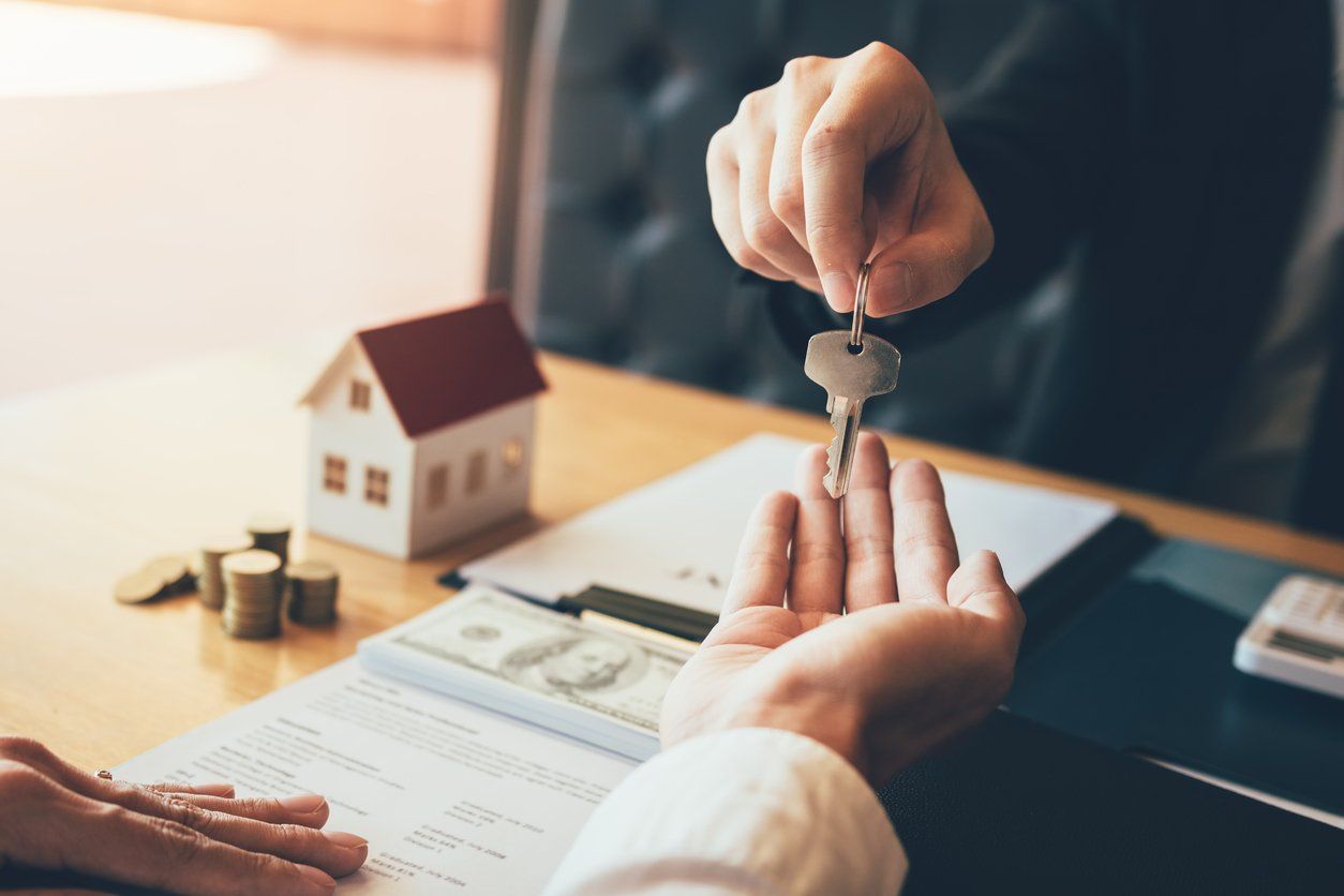 house keys being handed to a new resident