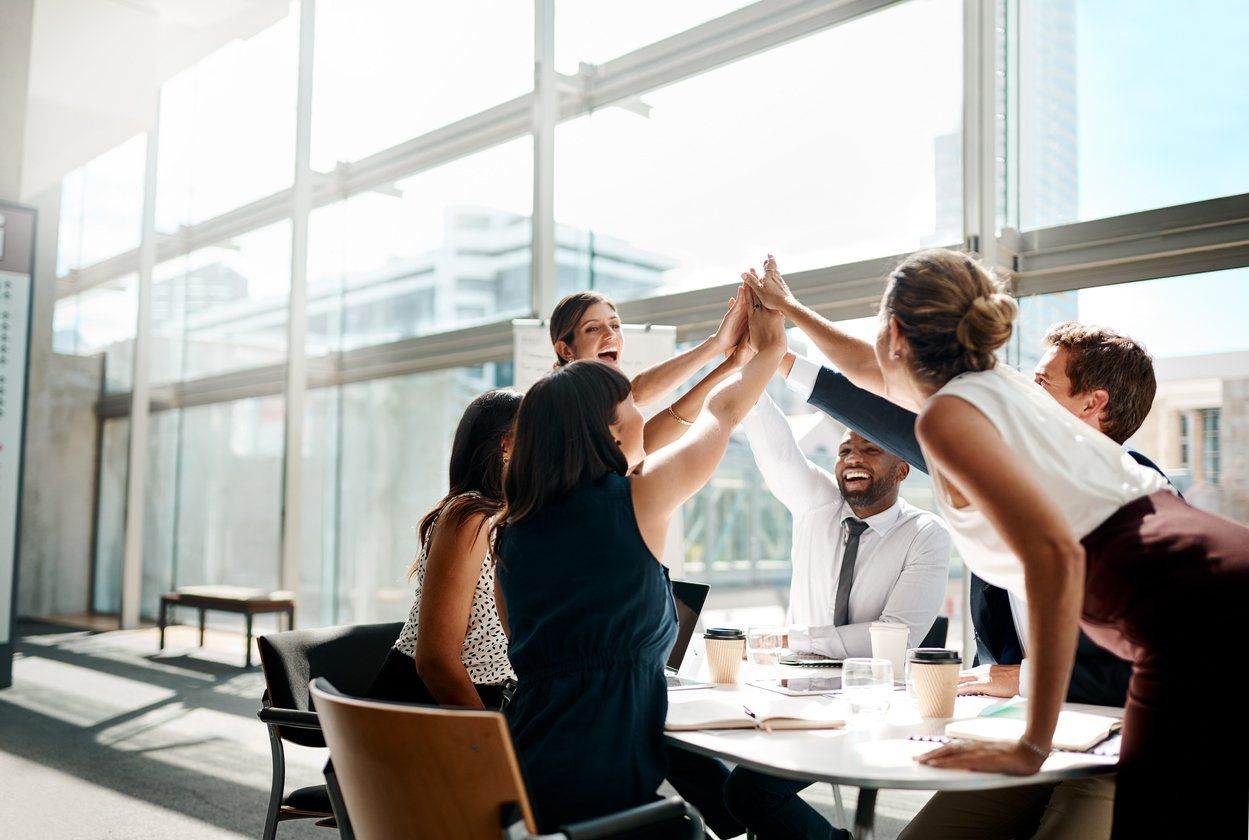 A team of people high five