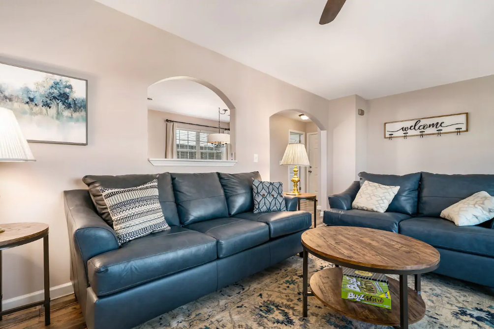 A living room with two couches and a coffee table.