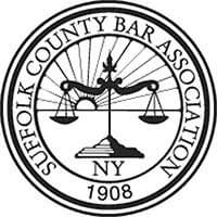 Suffolk County Bar Association circular seal with scales of justice and “NY 1908” text