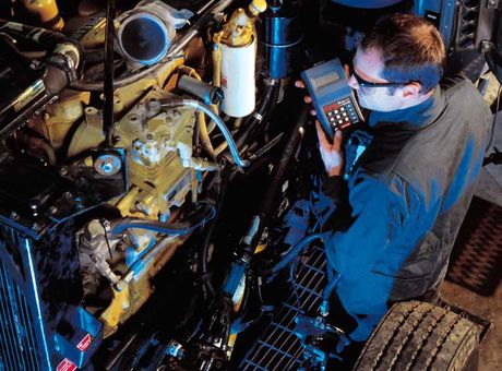 Mechanic working on truck engine Mechanic working on truck engine