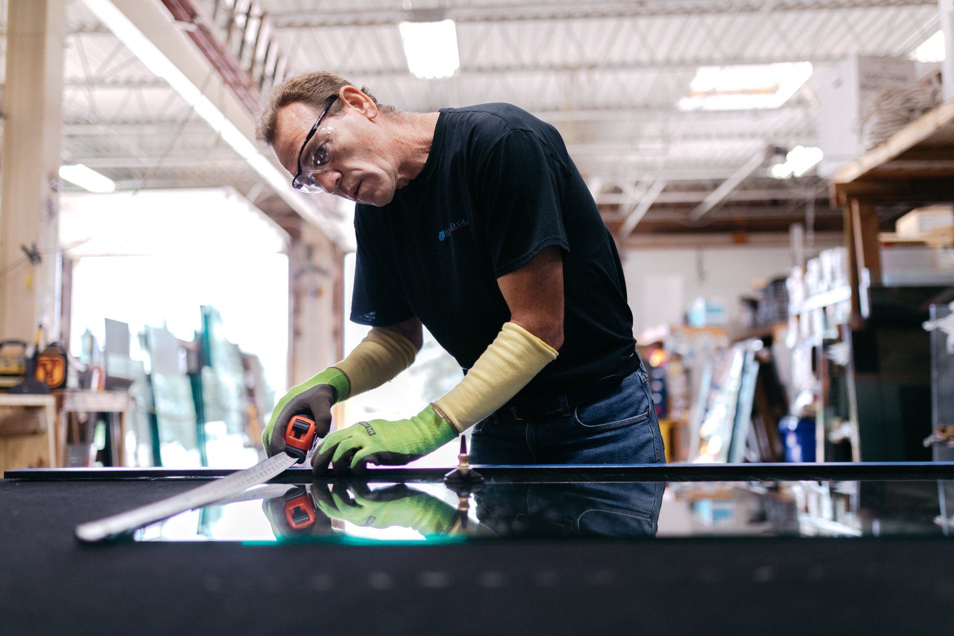 Glass Technician Measuring a Piece of Glass — Willoughby, OH — Euclid Glass & Door