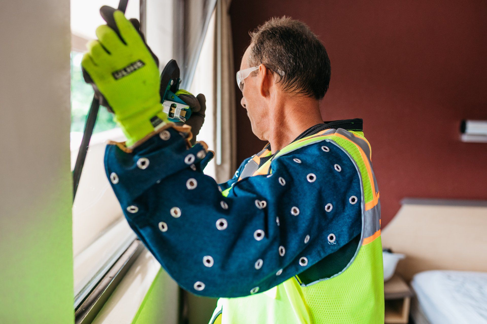 Technician Replacing a Broken Glass Window  — Willoughby, OH — Euclid Glass & Door