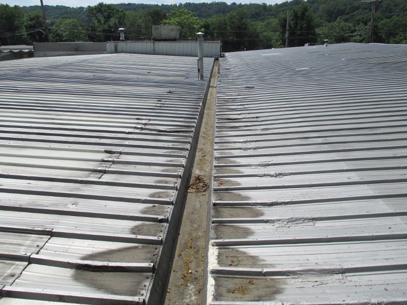 Commercial Roof with Wet Spots & Damage