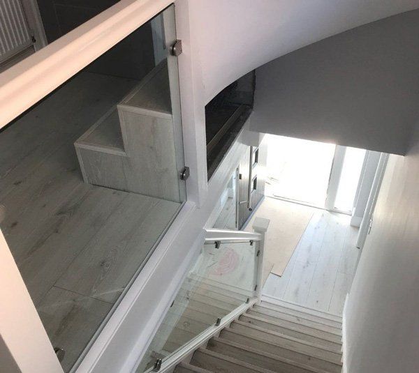 We install glass balustrades which are cut to suit any size. Glass on stairs in Brentwood. Glass staircases designed to suit your home in Shenfield. We also install glass banisters in Essex and Leigh on sea. We can also provide Toughened glass for your stairs in Hornchurch. These can be installed by a glass installer near me. For a bespoke look to your glass stairwell in Upminster. Shaped glass balustrades can be made to order in Romford or Chigwell and a usual lead time is 7 working days.