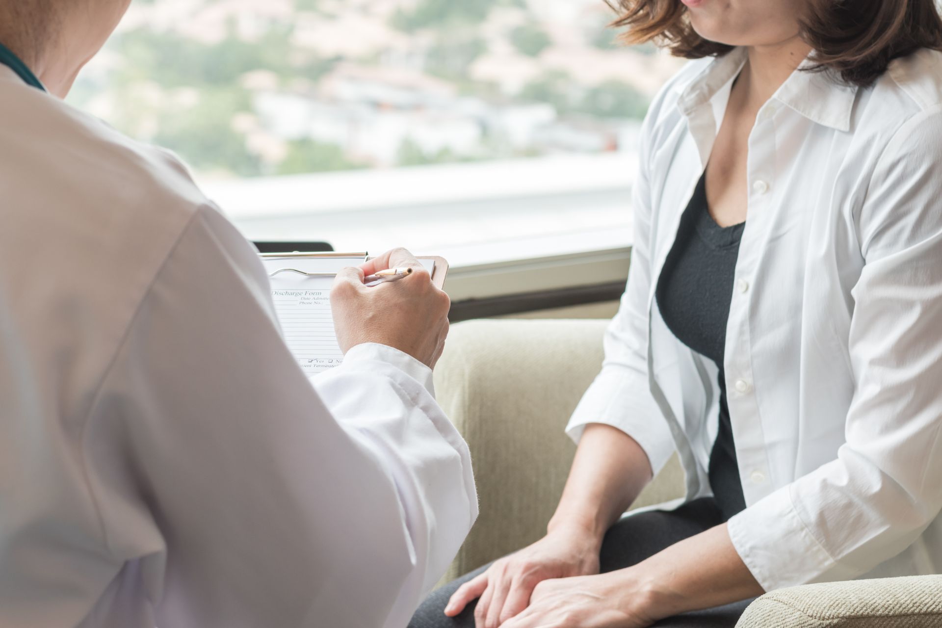 Doctor with patient and chart