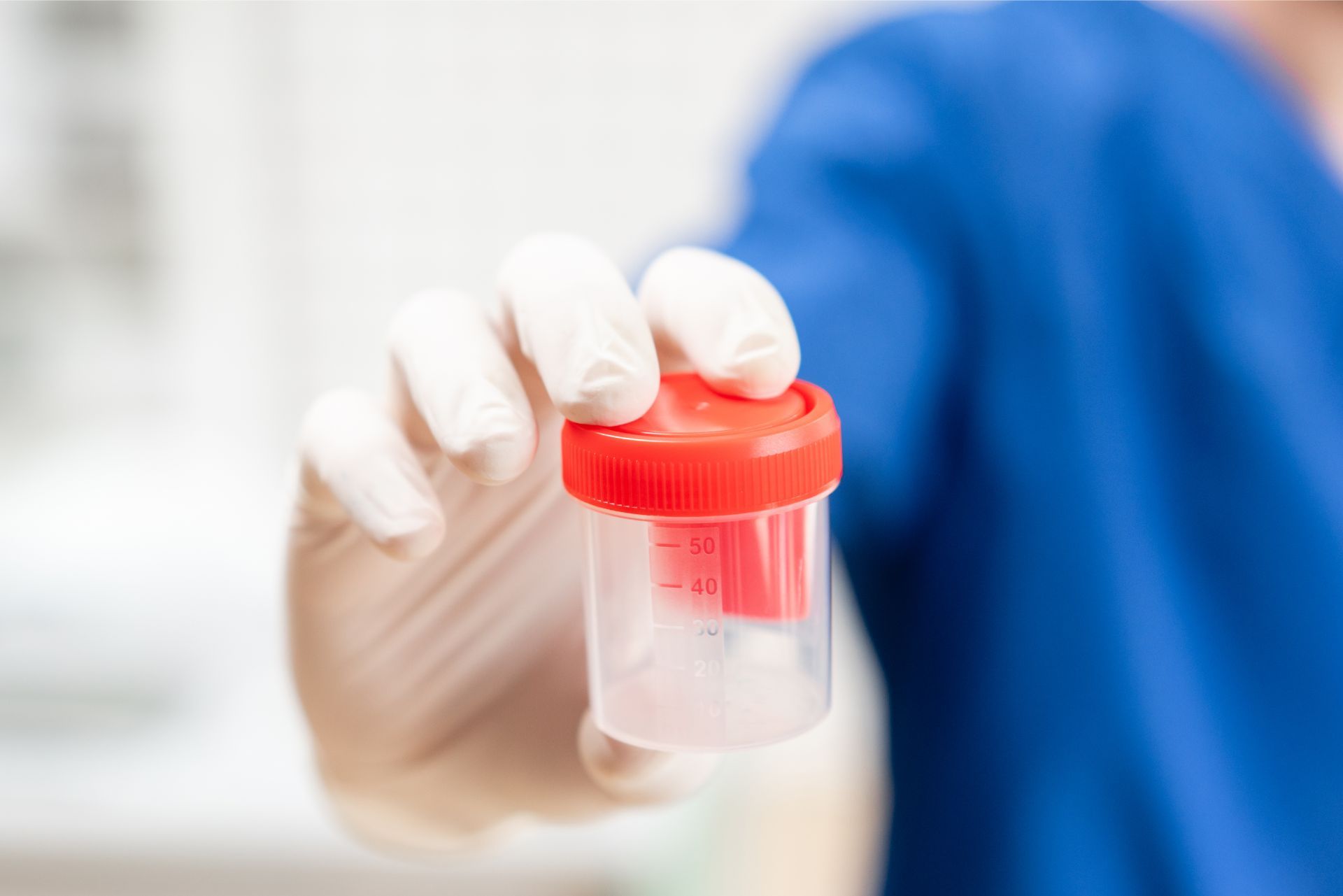 Doctor with sample bottle