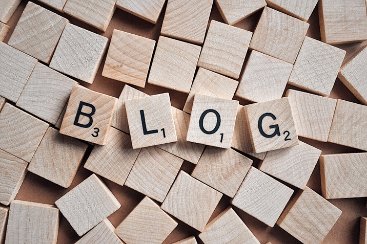 the word blog is written on wooden scrabble tiles