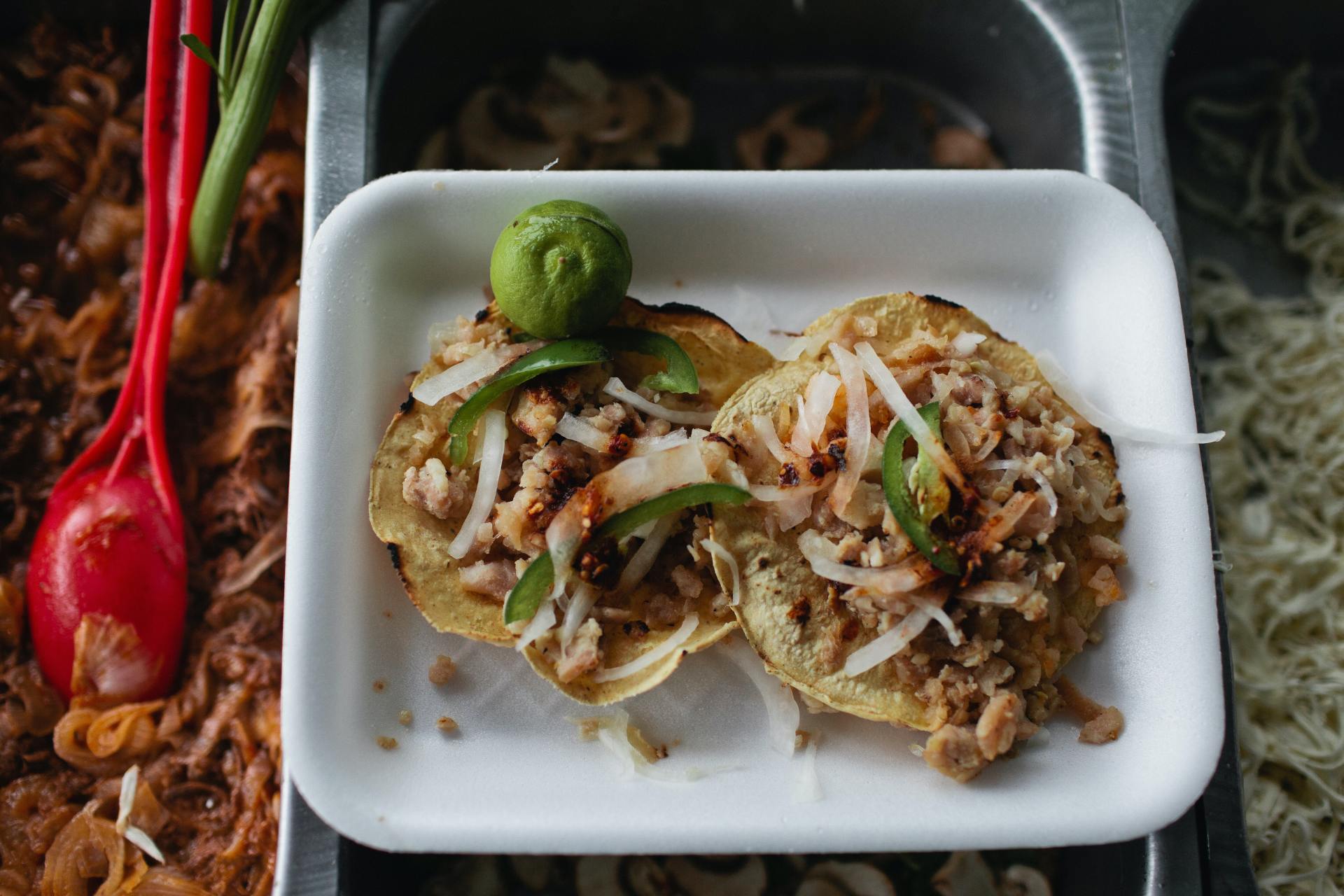 a tray of food with a lime on top of it
