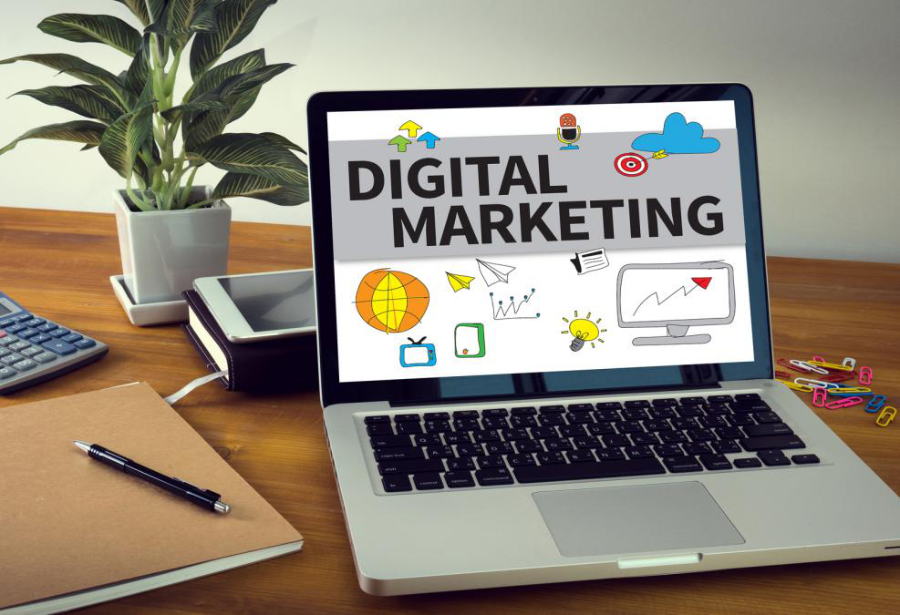 a laptop is open to a screen that says digital marketing