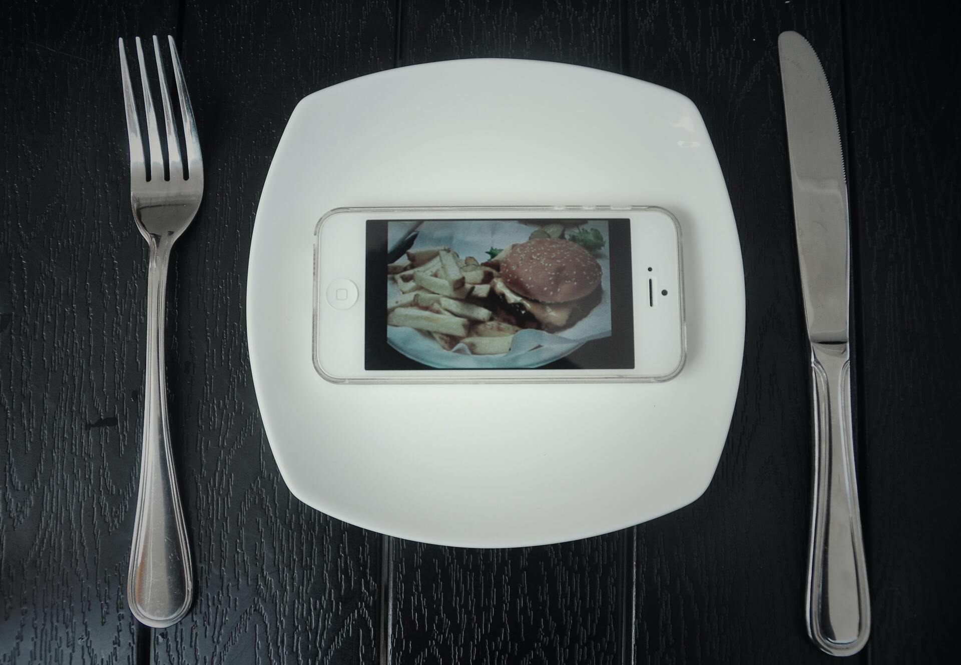 a white plate with a picture of a sandwich on it