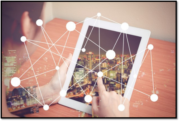 a person is using a tablet with a city in the background