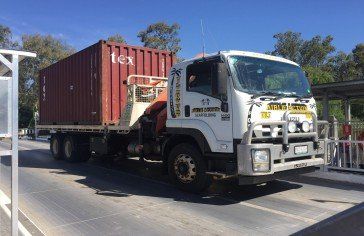 White truck With Red Container— Scaffolding hire Whitsundays in Arlie Beach, QLD