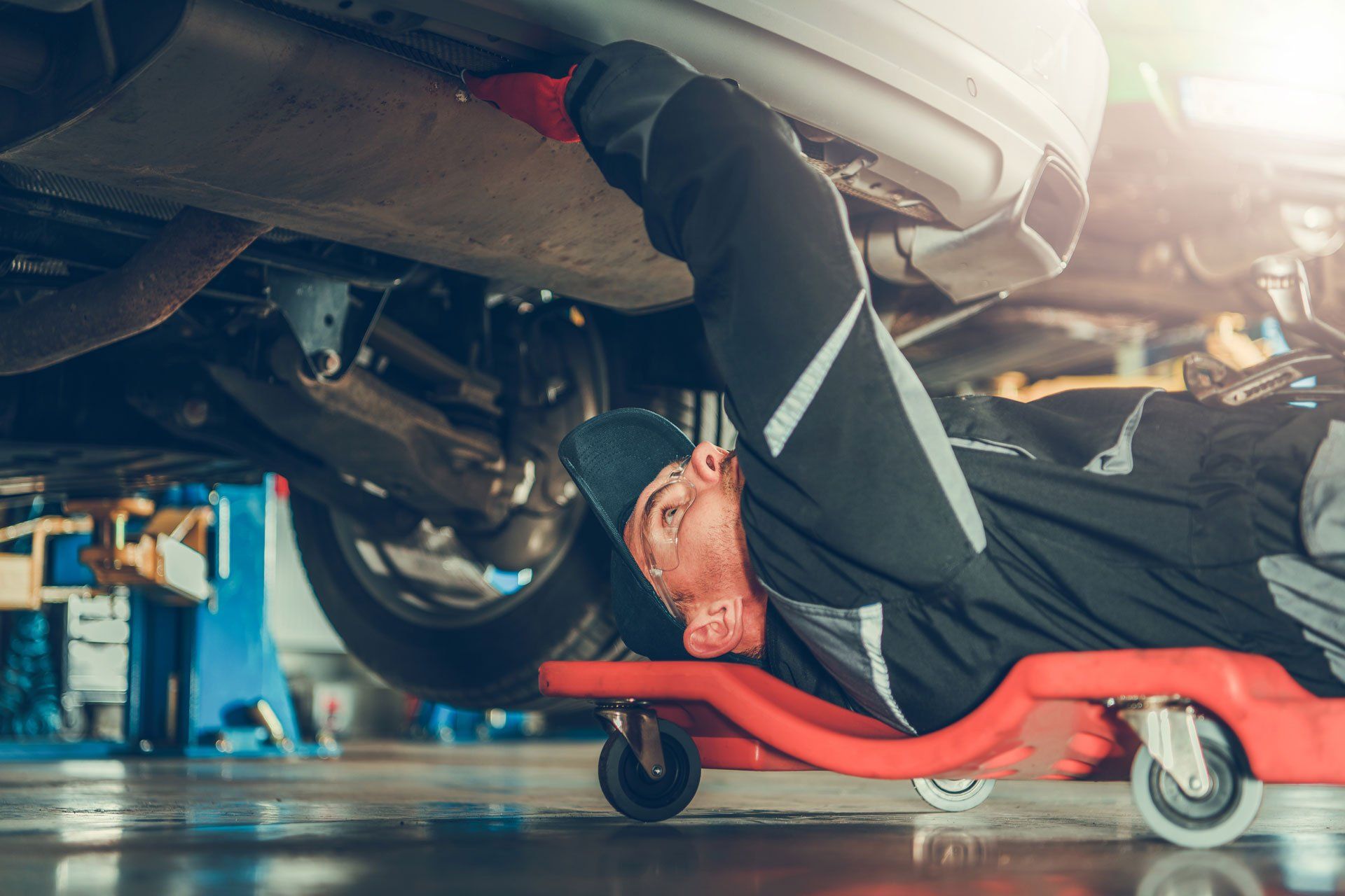 Mechanic Checking Under the Car — Oklahoma City, OK — Super Quick Express Lube