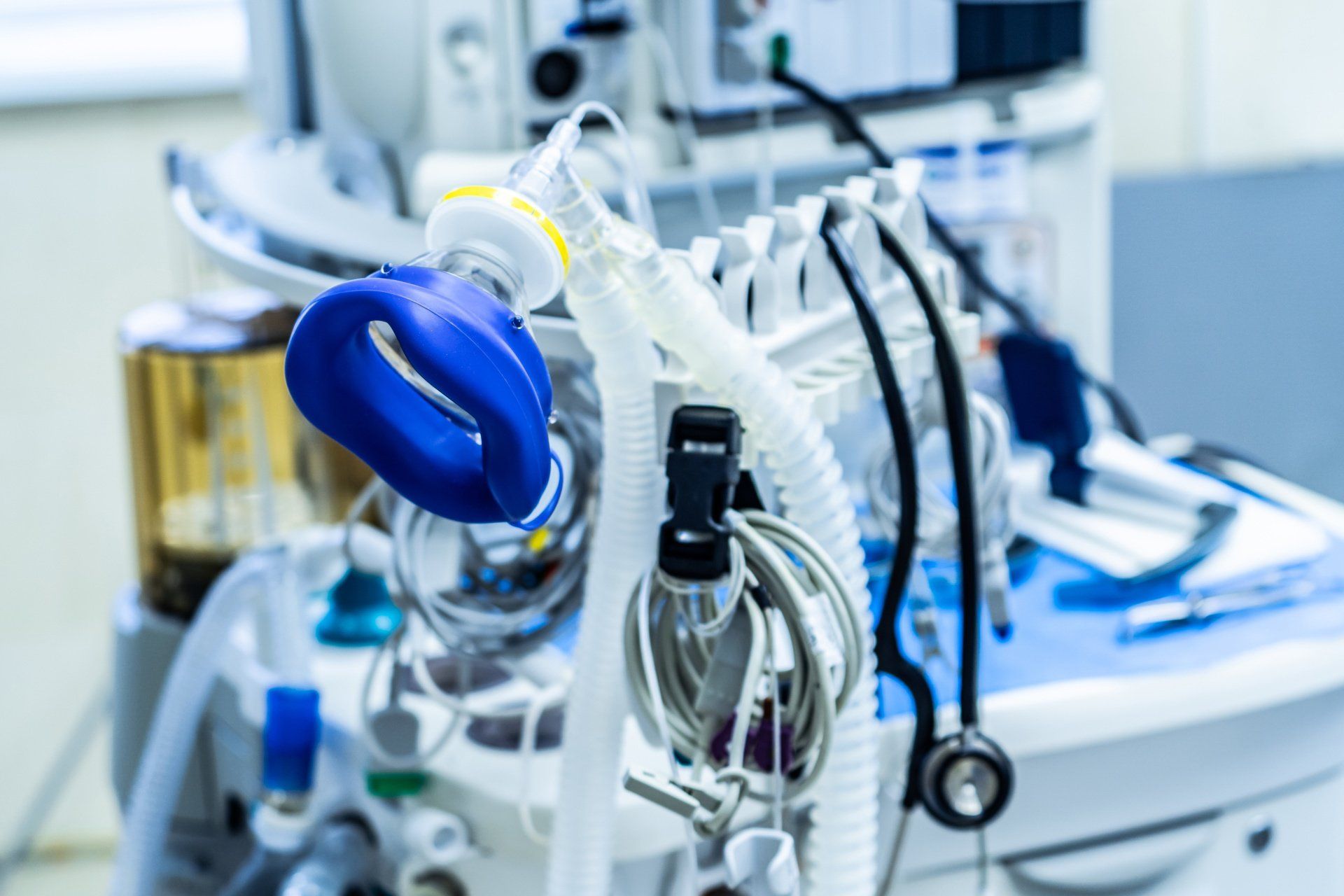 An oxygen mask is sitting on top of an operating room table.