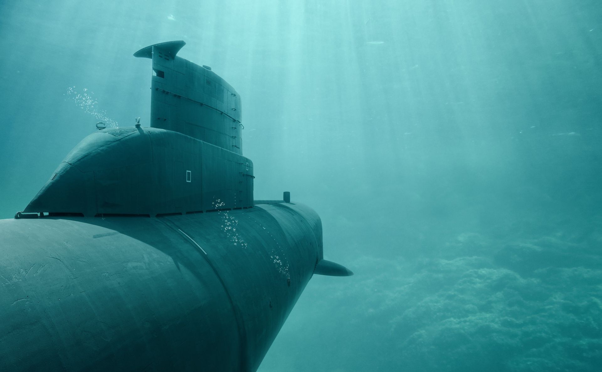 A submarine is floating on top of a body of water.