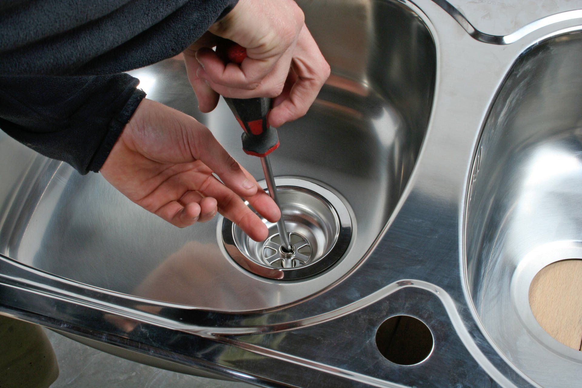 repairing the sink drain