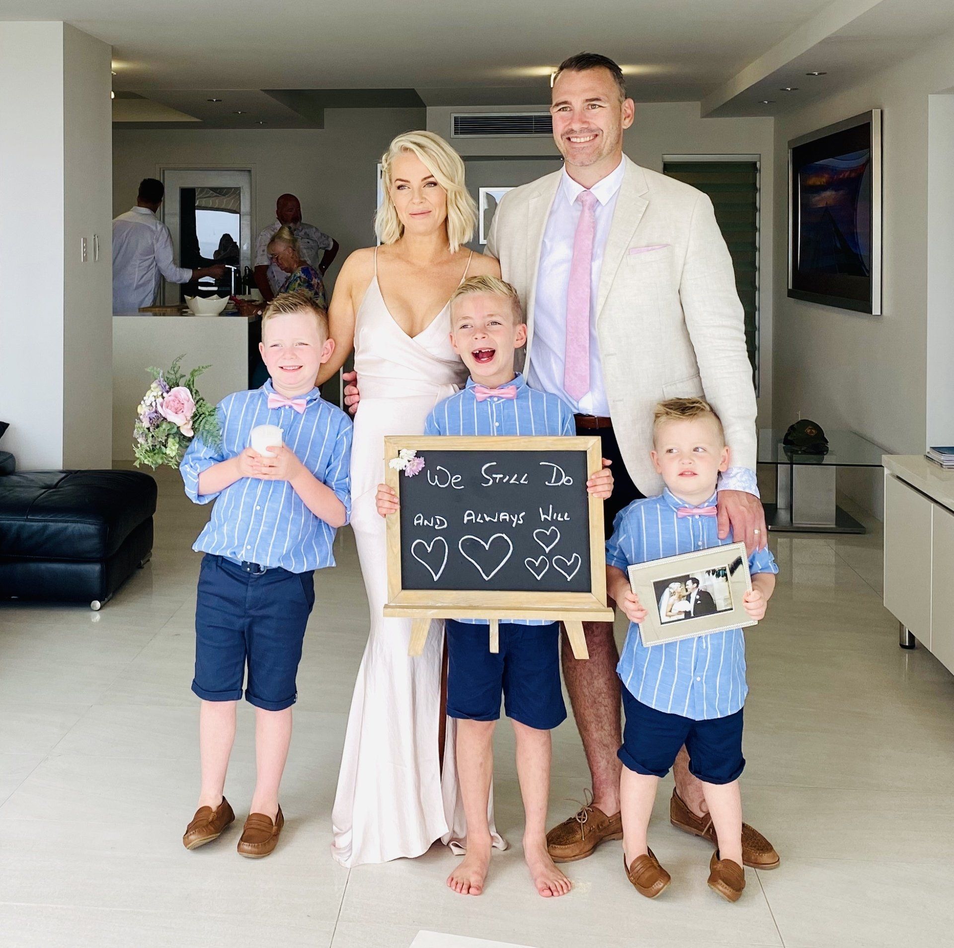 parenst with 3 young boys after their Noosa Vow renewal at Picture Point