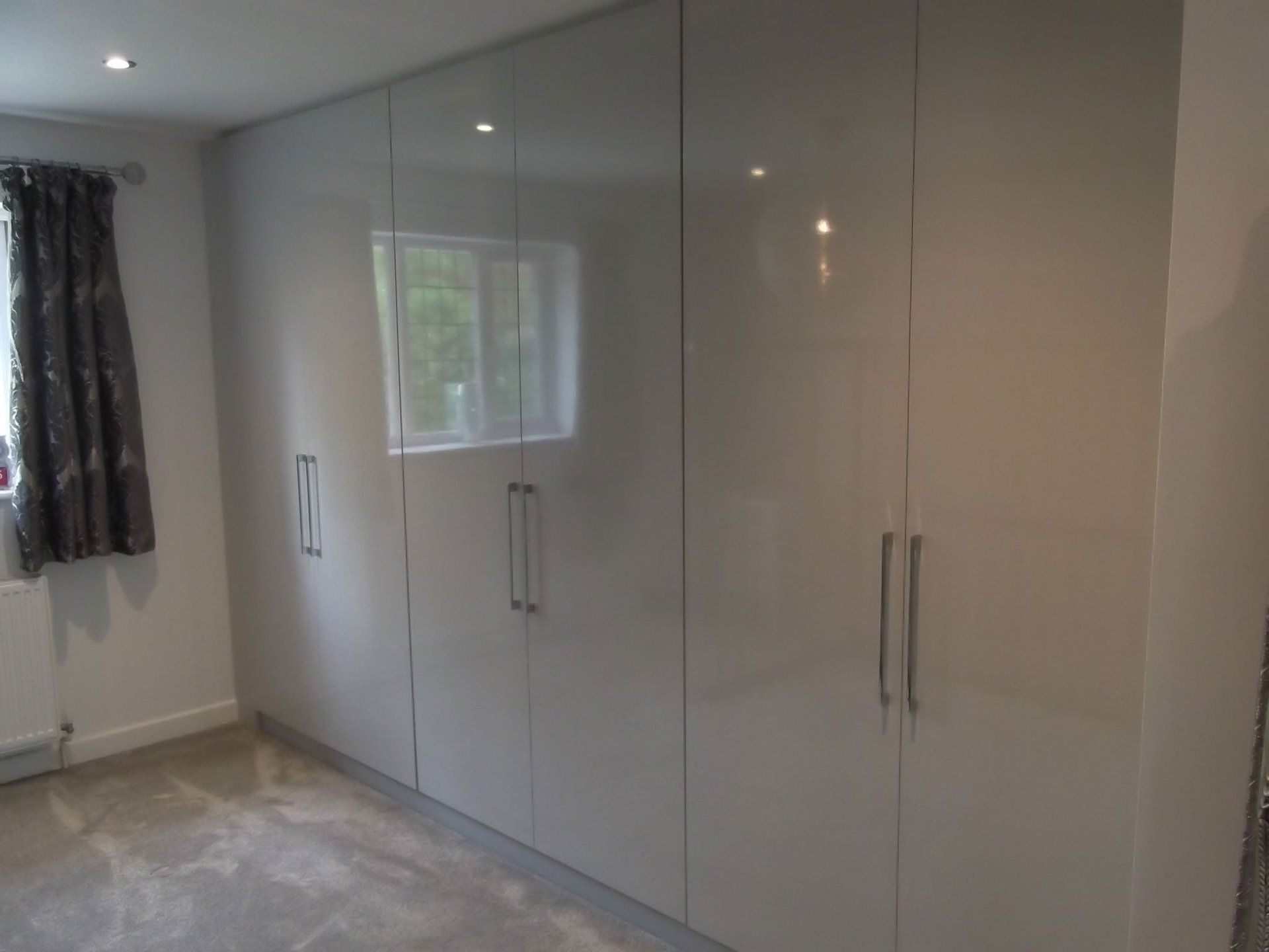 High gloss light grey wardrobes