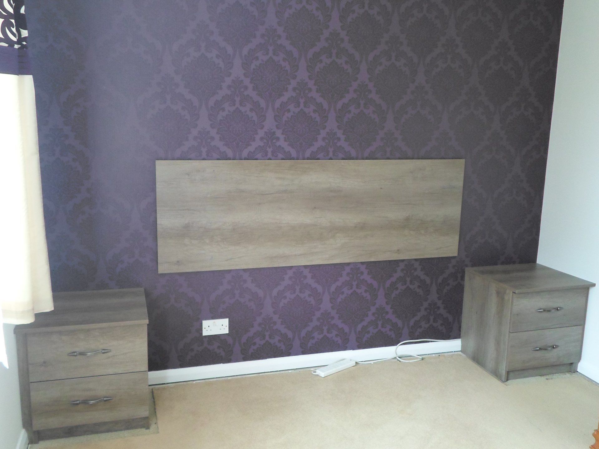 headboard fitted to wall
