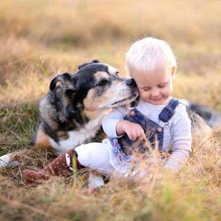 Veterinary Hospital — Baby and a Dog in Brenham, TX Veterinary Hospital — Baby and a Dog in Brenham, TX
