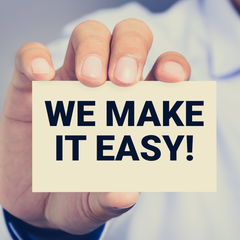 A person is holding a sign that says we make it easy