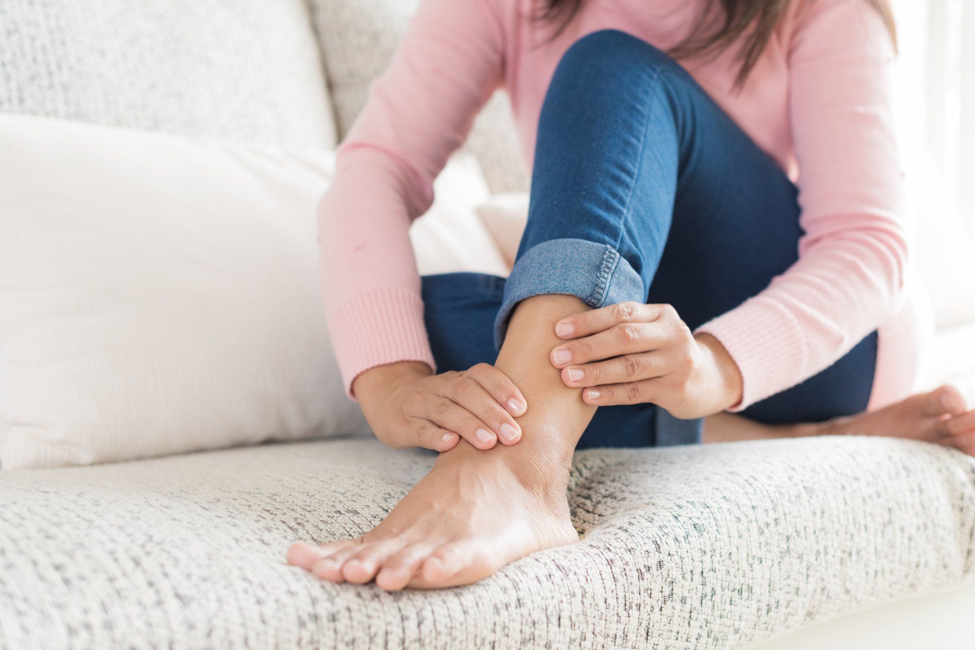 Podiatrist – Woman Holds Her Ankle Injury in West Chester, PA