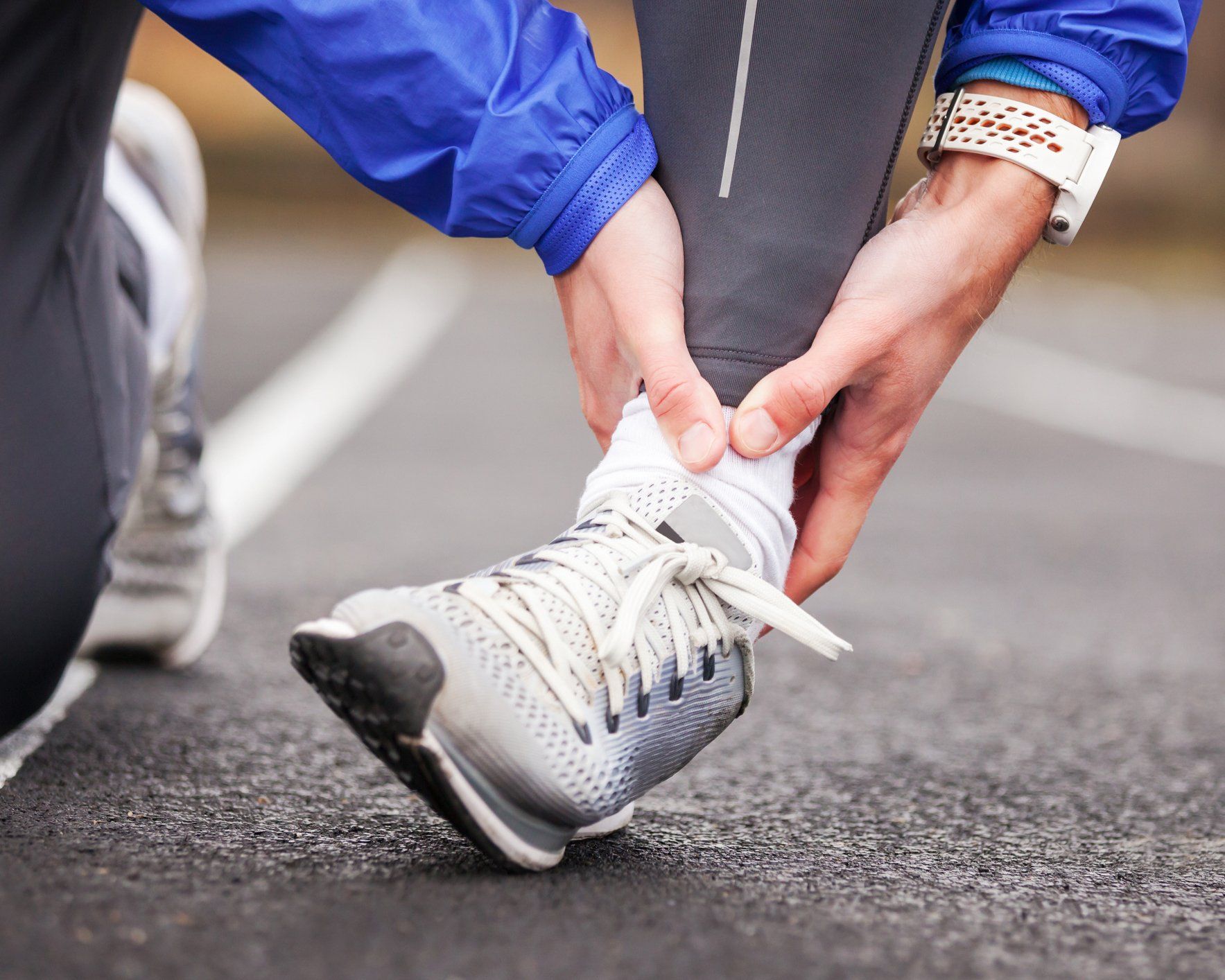 Foot Care Sports Fractures – Man Holding His Sprained Foot in West Chester, PA Foot Care Sports Fractures – Man Holding His Sprained Foot in West Chester, PA