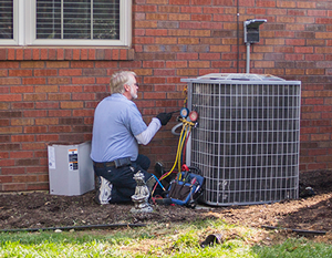 Preventative Maintenance — Man Working on AC Unit in Nashville, TN Preventative Maintenance — Man Working on AC Unit in Nashville, TN