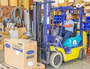 Residential Heating System — Man Working in Warehouse in Nashville, TN