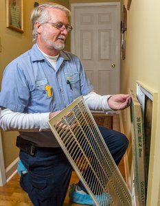 Protection Plan — Man Checking the AC in Nashville, TN Protection Plan — Man Checking the AC in Nashville, TN