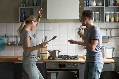 Couple dancing in front of their stove in Ballina Couple dancing in front of their stove in Ballina