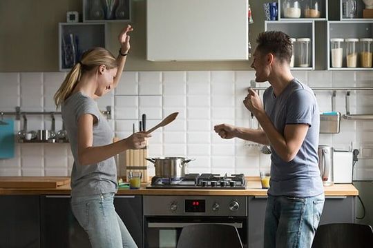 Couple dancing in front of their stove in Ballina Couple dancing in front of their stove in Ballina