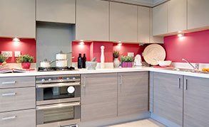 A contemporary kitchen with red walls