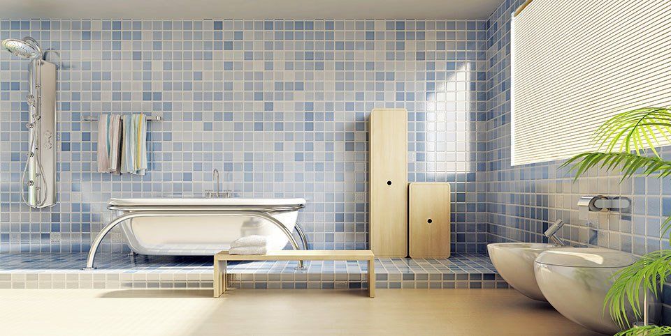 A modern bathroom with standalone bath and matching bidet and toilet