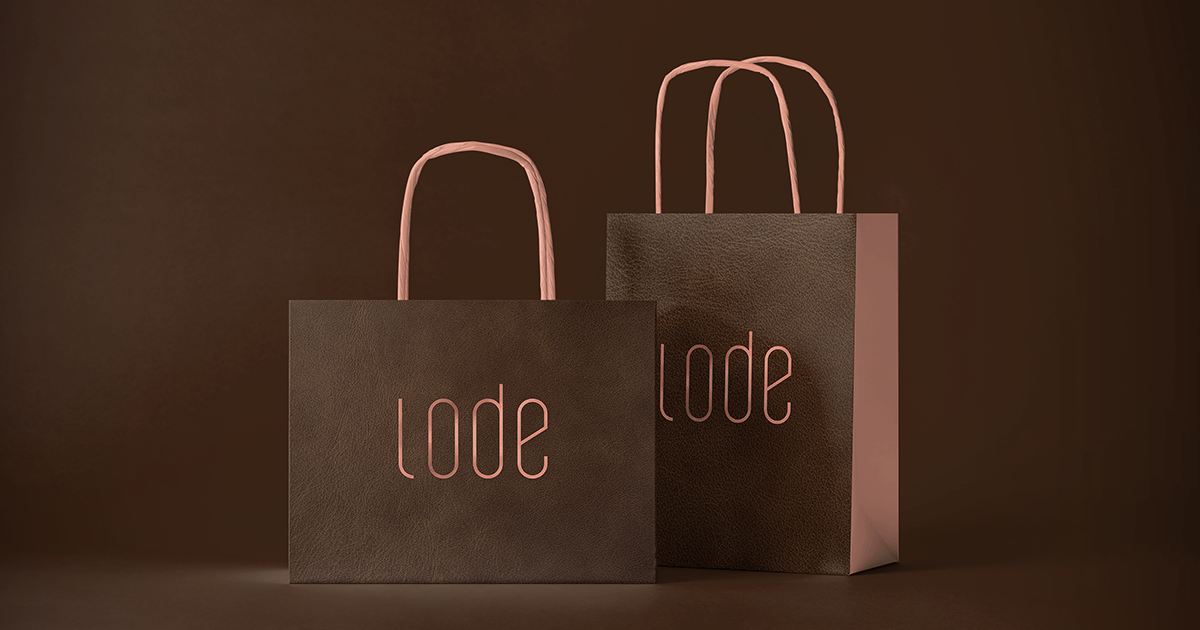 Two brown paper bags with the word lode on them