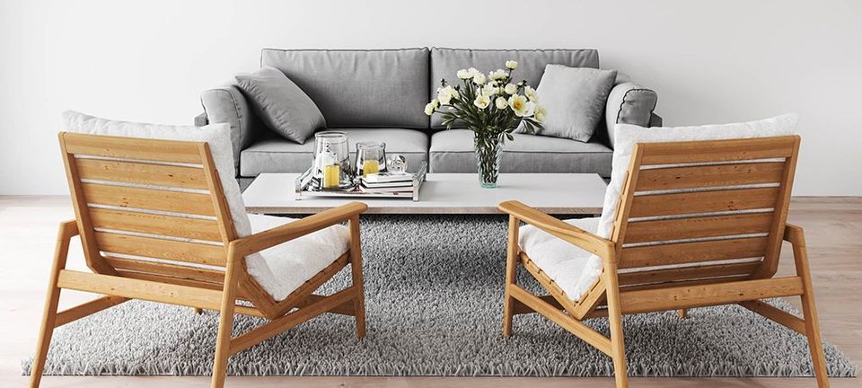 Grey couch with coffee table and chairs | Ernst Development LLC