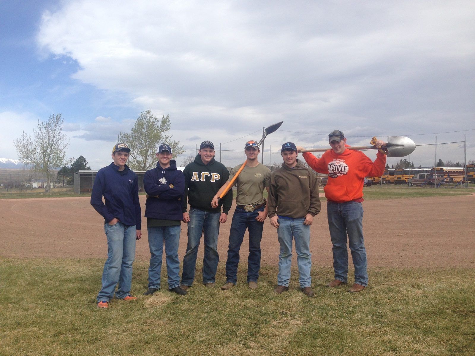 Brothers holding shovels
