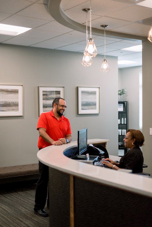 Pain Relief — Dr. Whidden Talking To His Staff in Springs, CO Pain Relief — Dr. Whidden Talking To His Staff in Springs, CO